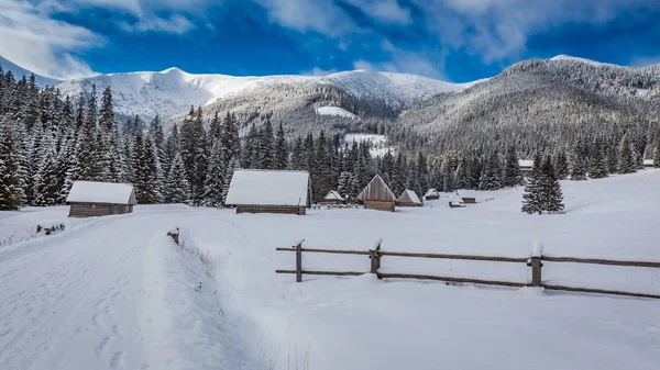 Cottages covered by snow at sunrise in winter, Tatra Mountains — Stock Photo, Image