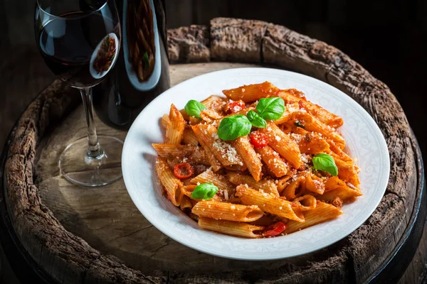 Enjoy your spaghetti bolognese with red wine and parmesan — Stock Photo, Image