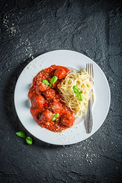 Spicy pasta bolognese with meatballs and parmesan — Stock Photo, Image