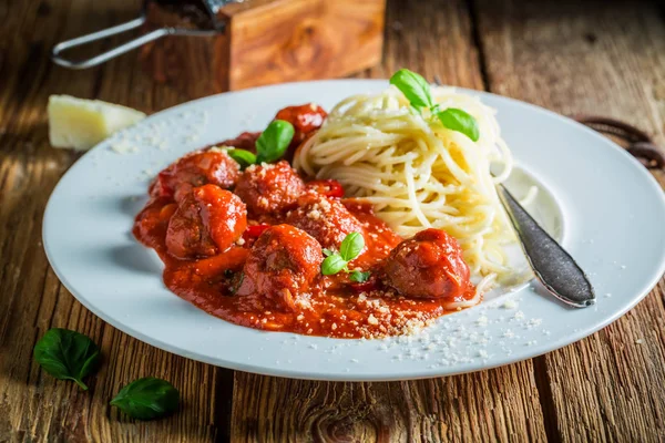 Tasty pasta bolognese with meatballs and parmesan — Stock Photo, Image