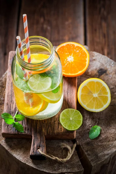 Fresh water with citrus fruits and mint leaves — Stock Photo, Image