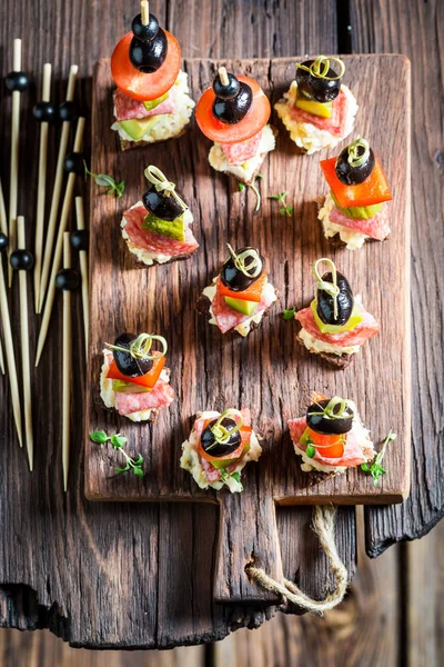 Delicious various finger food with vegetables and herbs for party — Stock Photo, Image