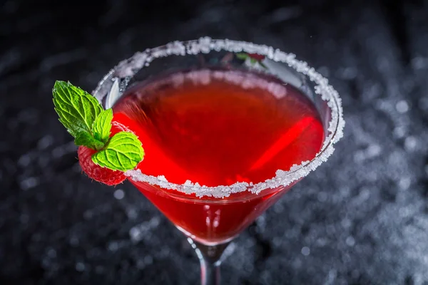 Cold classic Margarita with raspberries and mint on black rock — Stock Photo, Image