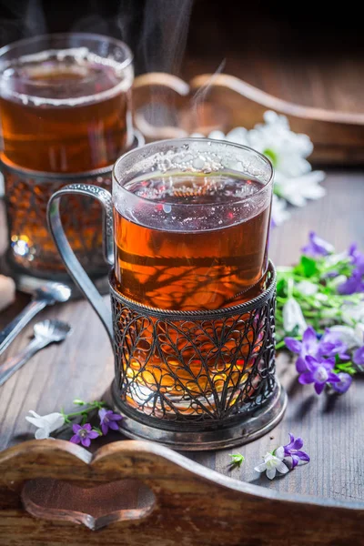 Healthy hot tea on old wooden table — Stock Photo, Image