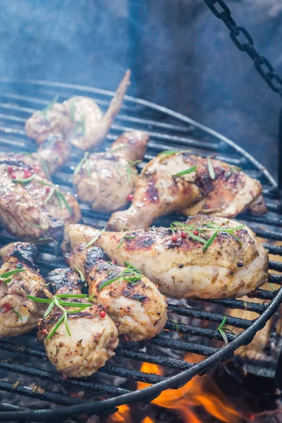 Hot chicken on grill with spices and rosemary for grill — Stock Photo, Image
