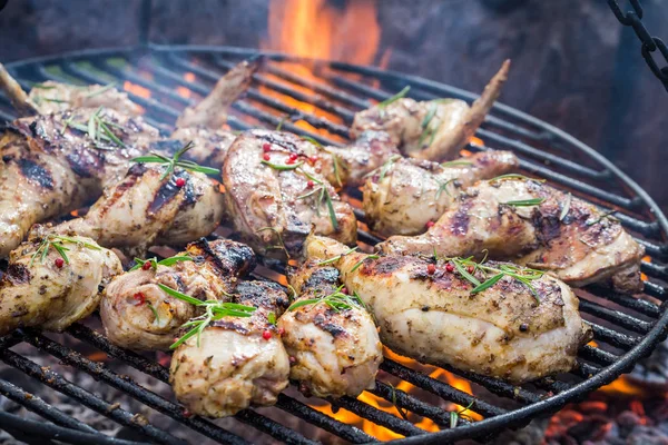 Spicy chicken on grill with spices and rosemary for grill — Stock Photo, Image