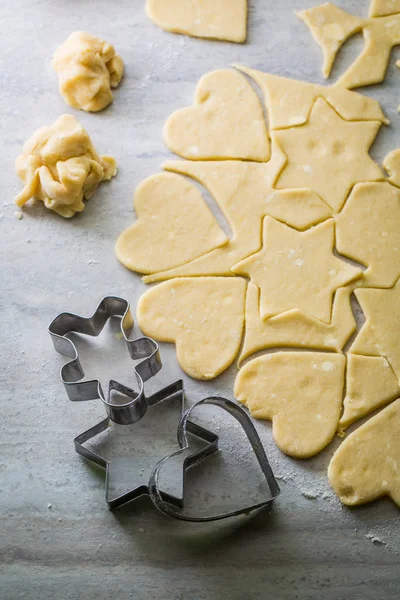 Cutting from fresh dough sweet butter cookies — Stock Photo, Image