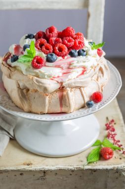 Homemade and rustic Pavlova cake with raspberries and meringue clipart