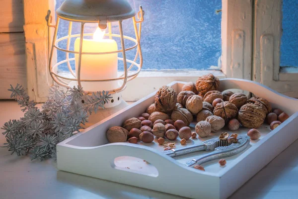 Tasty walnuts and hazelnuts for Christmas in cold night — Stock Photo, Image