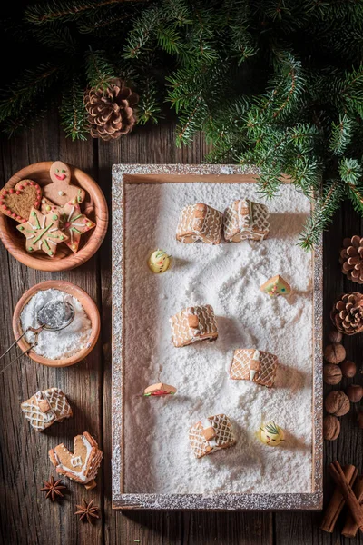 Homemade Christmas gingerbread village with snowman and trees — Stock Photo, Image