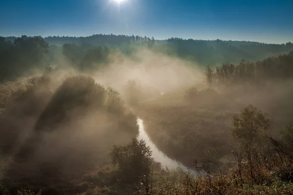 Amazing sunrise at foggy valley in autumn — Stock Photo, Image