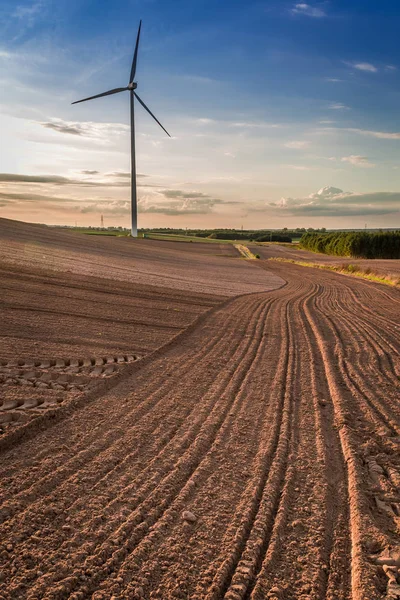 Wonderful dusk at field with wind turbine in autumn — Stock Photo, Image