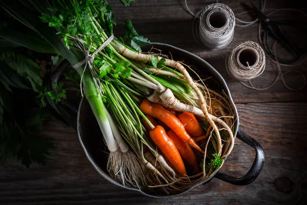 Ingredients for tasty vegan soup with carrots, parsley and leek — Stock Photo, Image