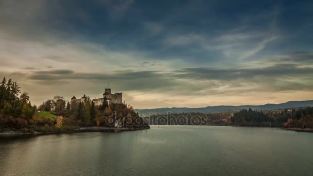 Niedzica castle by lake in autumn at sunset, Poland, Timelapse — Stock Video