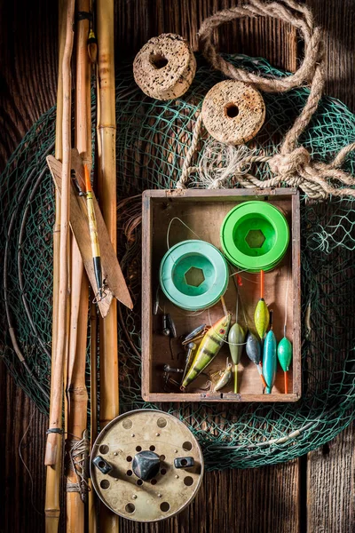 Retro angler equipment with fishing flies and rods — Stock Photo, Image
