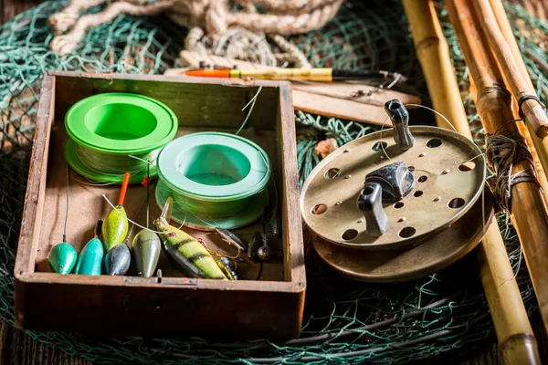 stock image Vintage fishing tackle with fishing rod and lures