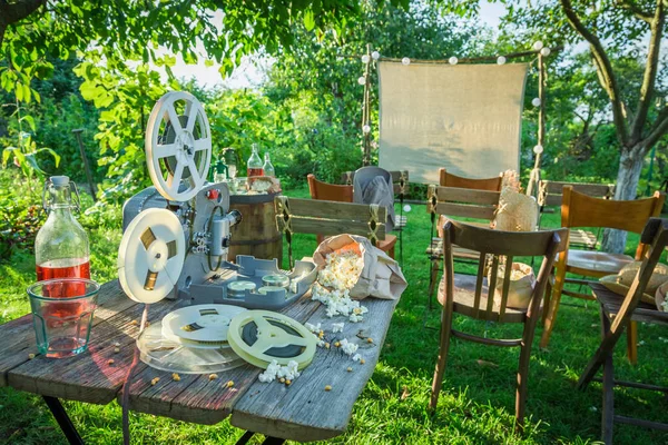 Open-air cinema with old analog films in the garden