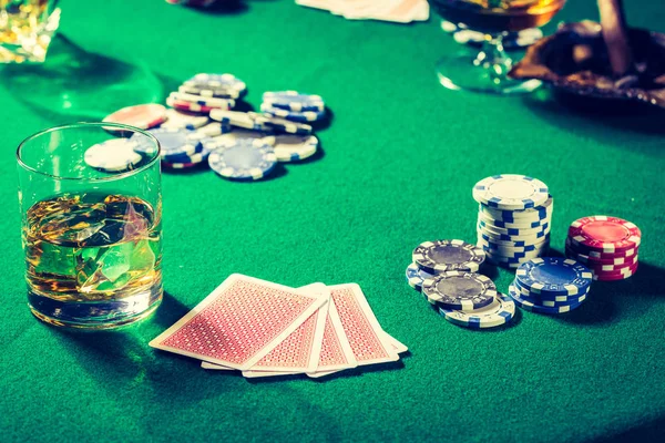 Cards and chips in green gambling table — Stock Photo, Image