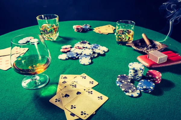 Whiskey, cigar and cards in old green table for poker — Stock Photo, Image
