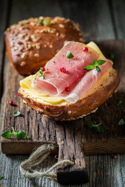 Fresh roll with ham and cheese for breakfast — Stock Photo, Image