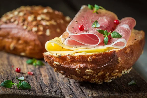 Closeup of bun with ham and cheese for breakfast — Stock Photo, Image