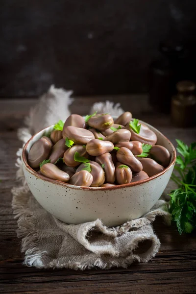 Fresh broad beans boiled with parsley and garlic — Stock Photo, Image