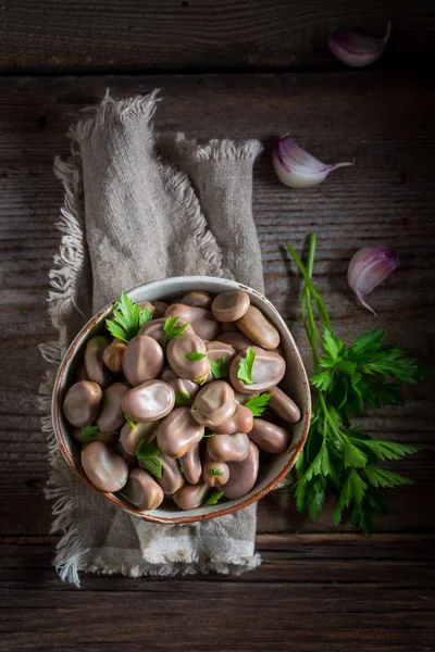 Healthy broad beans boiled with parsley and garlic — Stock Photo, Image