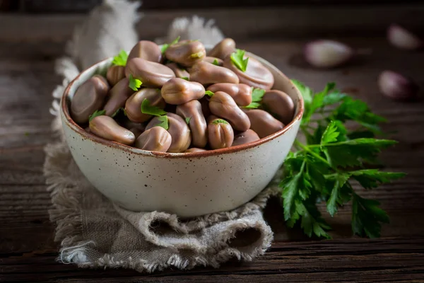 Delicious broad beans with garlic and parsley — Stock Photo, Image