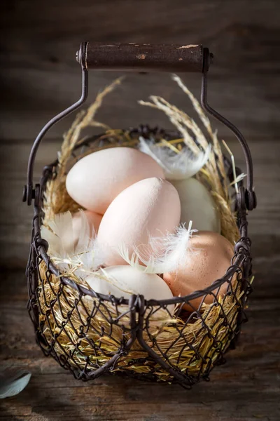 Closeup of free range eggs in old basket — Stock Photo, Image