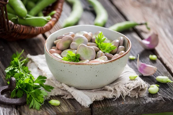 Tasty broad beans in old rustic kitchen — Stock Photo, Image