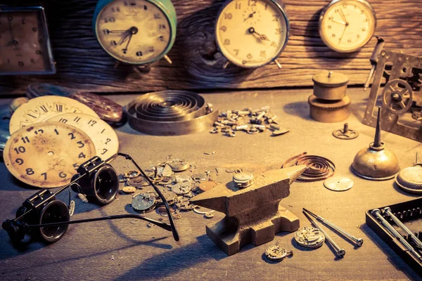 Old workshop with parts of clocks and tools — Stock Photo, Image