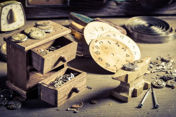Small watchmaker's room with spare parts of clocks — Stock Photo, Image