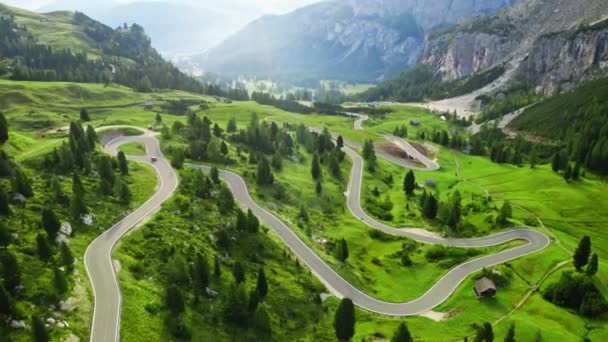 Winding road at Passo Gardena, Dolomites, aerial view — ストック動画