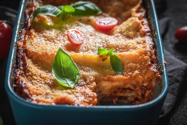 Tasty lasagna baked in casserole with cheese — ストック写真