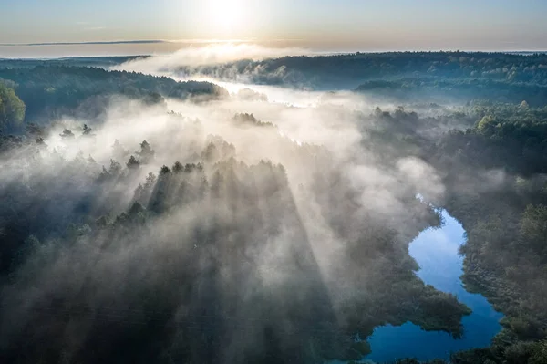 Wonderful fog over river with rays in autumn, aerial view — Stock Photo, Image