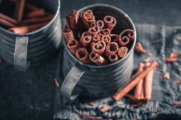 Intense cinnamon sticks on a dark background — Stock Photo, Image