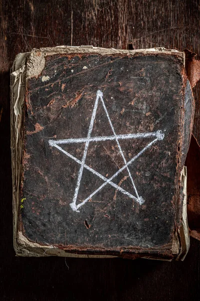 Vintage thick book with a pentagram symbol — Stock Photo, Image