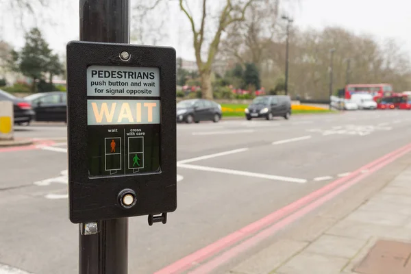 Pedestrian button indicating wait in London, UK — Stock Photo, Image