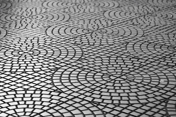 Curved mosaic stone pavement texture