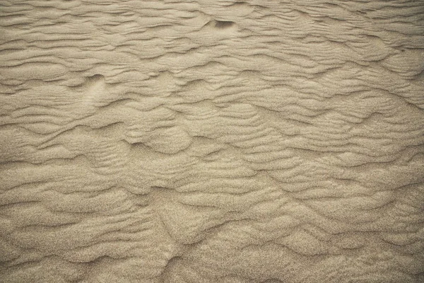 Паттерны в песке — стоковое фото