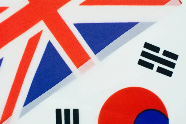 Colorful flag of great britain and national flag of south korea