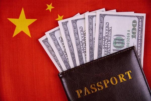 passport and money on the China flag