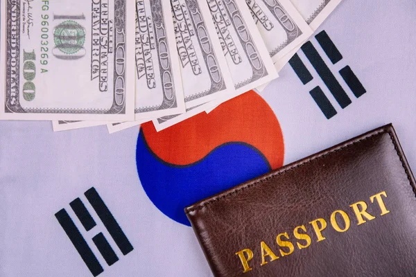 passport and money on the South Korea flag