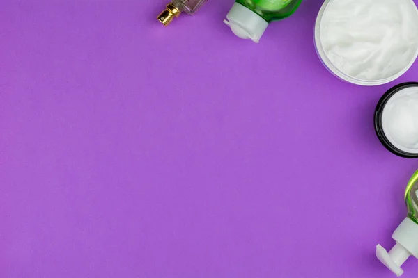 beauty flat lay. self-care products on a purple background. frame