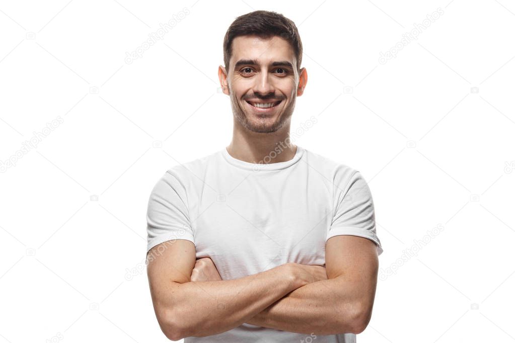 Portrait of smiling handsome man in blank t-shirt standing with 