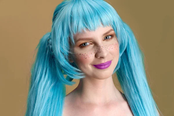 large detailed Studio portrait of a young stylish woman with long blue hair and freckles with positive emotions on her face