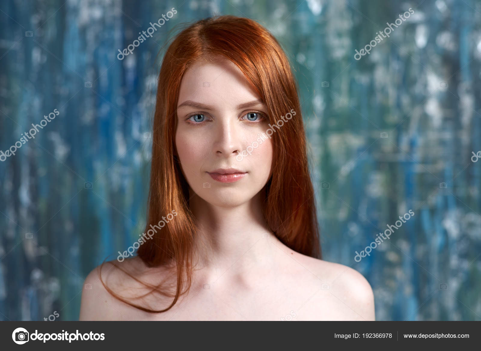 Contrast Studio Portrait Of A Young Woman With Long Red Hair And