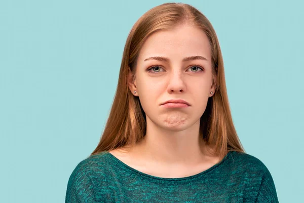 girl with ginger hair green eyes wearing sweater