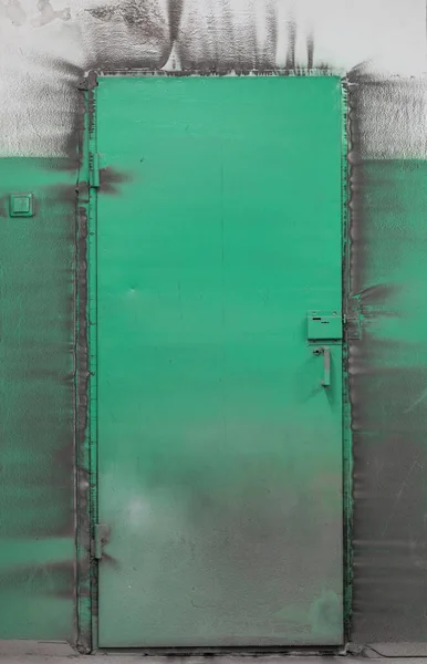 dirty, iron, green door in the technical room