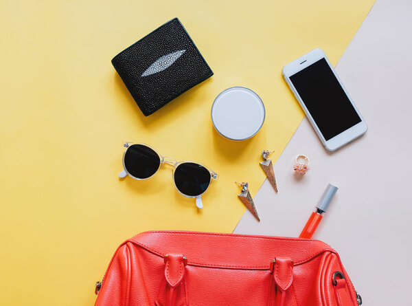Woman bag with cosmetics and smartphone 